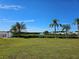 Peaceful waterfront view with lush greenery at 4301 Teakwood Cir, Bradenton, FL 34208