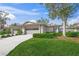 Two-car garage, well-manicured lawn, and attractive landscaping at 4442 Cayo Grande Dr # 25, Sarasota, FL 34233