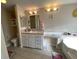 Main bathroom with double vanity, tub, and separate shower at 4851 W Gandy Blvd # 5Pa, Tampa, FL 33611