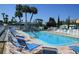 Inviting community pool with lounge chairs at 4851 W Gandy Blvd # 5Pa, Tampa, FL 33611