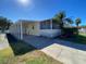 Spacious mobile home with covered carport and screened porch at 4851 W Gandy Blvd # 5Pa, Tampa, FL 33611