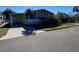 Mobile home with carport and spacious, grassy yard at 4851 W Gandy Blvd # 5Pa, Tampa, FL 33611