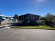 Mobile home with a large screened porch and landscaped yard at 4851 W Gandy Blvd # 5Pa, Tampa, FL 33611