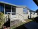 Mobile home showcasing a side view with steps and screened porch at 4851 W Gandy Blvd # 5Pa, Tampa, FL 33611