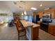 Bright kitchen, featuring wood cabinets and an island with seating at 4851 W Gandy Blvd # 5Pa, Tampa, FL 33611