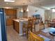 Open kitchen boasts an island, wood cabinets, and stainless steel appliances at 4851 W Gandy Blvd # 5Pa, Tampa, FL 33611
