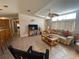 Living room with seating area and view into kitchen at 4851 W Gandy Blvd # 5Pa, Tampa, FL 33611