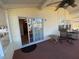 Relaxing screened porch with ceiling fan, outdoor seating, and view of backyard at 4851 W Gandy Blvd # 5Pa, Tampa, FL 33611