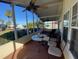 Spacious screened porch overlooks community; features ceiling fan at 4851 W Gandy Blvd # 5Pa, Tampa, FL 33611