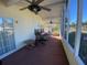 Screened porch with ceiling fan and rocking chairs at 4851 W Gandy Blvd # 5Pa, Tampa, FL 33611