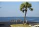 Serene waterfront park with benches at 4851 W Gandy Blvd # 5Pa, Tampa, FL 33611