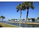 Scenic waterfront view with palm trees and gazebo at 4851 W Gandy Blvd # 5Pa, Tampa, FL 33611