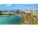 Aerial view of a vibrant cityscape with waterfront views, a marina, and high-rise buildings at 4906 Lighthouse Bay Ln, Bradenton, FL 34211
