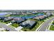 An aerial view showcases the home's waterfront location and well-manicured lawn at 4906 Lighthouse Bay Ln, Bradenton, FL 34211