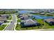 An aerial view shows the home nestled in the community with gorgeous lake views at 4906 Lighthouse Bay Ln, Bradenton, FL 34211