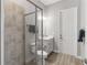 Bathroom boasts a glass-enclosed shower, wood-look tile flooring, and a modern vanity at 4906 Lighthouse Bay Ln, Bradenton, FL 34211