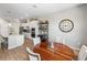 Open-concept kitchen and breakfast nook features a wooden table and seating for four at 4906 Lighthouse Bay Ln, Bradenton, FL 34211