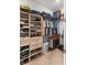 Spacious walk-in closet with custom shelves, drawers, hanging rods, and plenty of storage space at 4906 Lighthouse Bay Ln, Bradenton, FL 34211