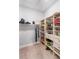Walk-in closet with shelving units and hanging rods for clothing and storage at 4906 Lighthouse Bay Ln, Bradenton, FL 34211