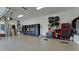 Spacious garage featuring epoxy floor, ample storage cabinets, and organized tool racks at 4906 Lighthouse Bay Ln, Bradenton, FL 34211