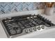 Close-up of a gas cooktop with stainless steel knobs and a Frigidaire Gallery label at 4906 Lighthouse Bay Ln, Bradenton, FL 34211