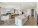 Open-concept kitchen featuring an island, modern appliances, and views of the living room at 4906 Lighthouse Bay Ln, Bradenton, FL 34211