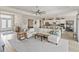 Open-concept living room connects to the kitchen and has a large sectional sofa at 4906 Lighthouse Bay Ln, Bradenton, FL 34211