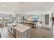 Open layout featuring kitchen, dining area, and living room with lots of natural light at 4906 Lighthouse Bay Ln, Bradenton, FL 34211
