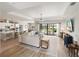 Bright, open-concept living area with tile floors and access to the outdoor patio at 4906 Lighthouse Bay Ln, Bradenton, FL 34211