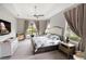 Bright bedroom with sitting area, ceiling fan and lanai access at 4906 Lighthouse Bay Ln, Bradenton, FL 34211
