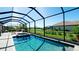 Screened-in pool with a spa and lush landscaping, creating a private oasis at 4906 Lighthouse Bay Ln, Bradenton, FL 34211