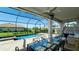 Screened-in pool and patio with a covered seating area, perfect for entertaining and relaxing at 4906 Lighthouse Bay Ln, Bradenton, FL 34211