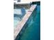 This pool with a tile spillway offers relaxation at 4906 Lighthouse Bay Ln, Bradenton, FL 34211
