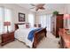 Spacious bedroom with a sleigh bed and wood armoire at 5352 Layton Dr, Venice, FL 34293