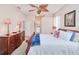 Comfortable bedroom featuring a ceiling fan and ample natural light at 5352 Layton Dr, Venice, FL 34293