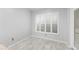 Simple dining area with tile flooring and window with shutters at 5358 Everwood Run, Sarasota, FL 34235