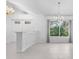 Open dining area with tile floors and natural light at 5358 Everwood Run, Sarasota, FL 34235