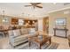 Open concept living room with kitchen and breakfast bar visible at 5935 Caspian Tern Dr, Sarasota, FL 34238