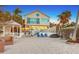 Backyard with patio furniture, white picket fence, gazebo and palm trees at 681 Casey Key Rd, Nokomis, FL 34275