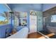 Bright bathroom with glass enclosed shower, stand alone bathtub and ocean view at 681 Casey Key Rd, Nokomis, FL 34275