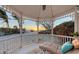 Relaxing gazebo featuring comfortable lounge seating with stunning views of the beach and sunset at 681 Casey Key Rd, Nokomis, FL 34275