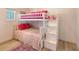 bedroom with a built-in bunk bed and pink bedding at 681 Casey Key Rd, Nokomis, FL 34275