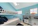 Bedroom with bunkbeds, vaulted ceilings, light blue walls, and tile floors at 681 Casey Key Rd, Nokomis, FL 34275