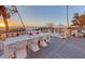 Oceanfront deck with outdoor dining and lounge seating for enjoying sunsets and sea breezes at 681 Casey Key Rd, Nokomis, FL 34275