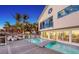 Stunning home exterior with a beautiful pool, deck, palm trees, and scenic ocean views at 681 Casey Key Rd, Nokomis, FL 34275