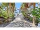Elegant home featuring a private drive, two-car garage, and lush landscaping at 681 Casey Key Rd, Nokomis, FL 34275