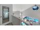 Bright open living room with ocean view, modern furnishings, and access to the outdoor deck at 681 Casey Key Rd, Nokomis, FL 34275