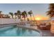 Resort-style pool with a deck, outdoor seating, palm trees, and breathtaking ocean views at 681 Casey Key Rd, Nokomis, FL 34275