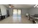 Bright dining area with tile floors, a table, and access to a patio at 6820 Myrtlewood Rd, North Port, FL 34287