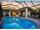 Spacious pool area with screened enclosure and lounge chairs at 7448 39Th E Ct, Sarasota, FL 34243